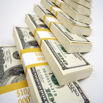 Row of Stacks of One Hundred Dollar Bills